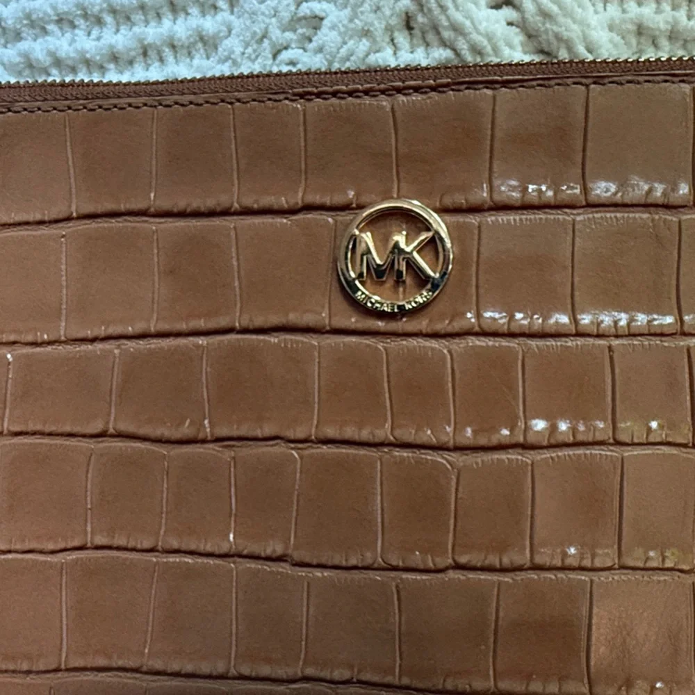 Michael Kors Wristlet Envelope style Clutch Embossed Leather Walnut color.